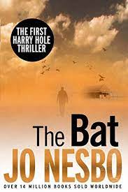 Off the shelf, Cover for Random House vintage edition of The Bat by Jo Nesbo, first book in Harry Hole series showing back of a man walking in an isolated, desert or beach location towards what looks like a house, all done in brown-orange tones with several birds flying above his head and scattered white clouds in a blue gray sky overhead with the title of the book in black letters with the author's name in brown-orange all capital letters across the bottom with a line in black text underneath that says Over 14 million books sold worldwide