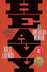 Book cover for Heavy An American Memoir by Kiese Laymon dark rust red cover with large black capital letters showing the title vertically from top to bottom