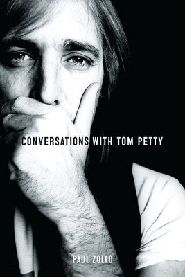 9781787601628 Book cover for Conversations with Tom Petty by Paul Zollo, full-page black and white image of the musician Tom Petty looking into the camera, with a black background