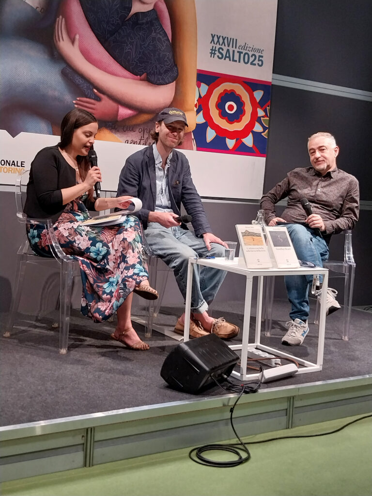 photo of author Michael Bible in conversation with author Matteo B. Bianchi at the 2025 Salone Internazionale del Libro in Turin, Italy, in May 2025
focus on focus