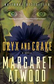 Book cover for Oryx and Crake by Margaret Atwood showing the top half of a woman's face with her eyes staring at you, a large blue flower in the place of her mouth