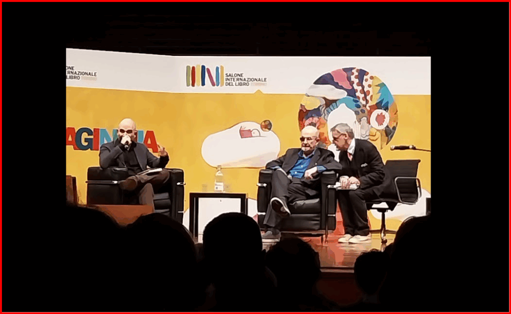 Salman Rushdie and Roberto Saviano with translator at Salone del Libro Turin Torino Italy May 2024